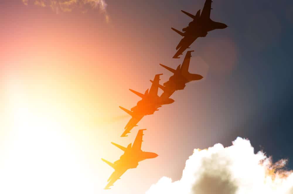 fighter jets against the background of sunbeams