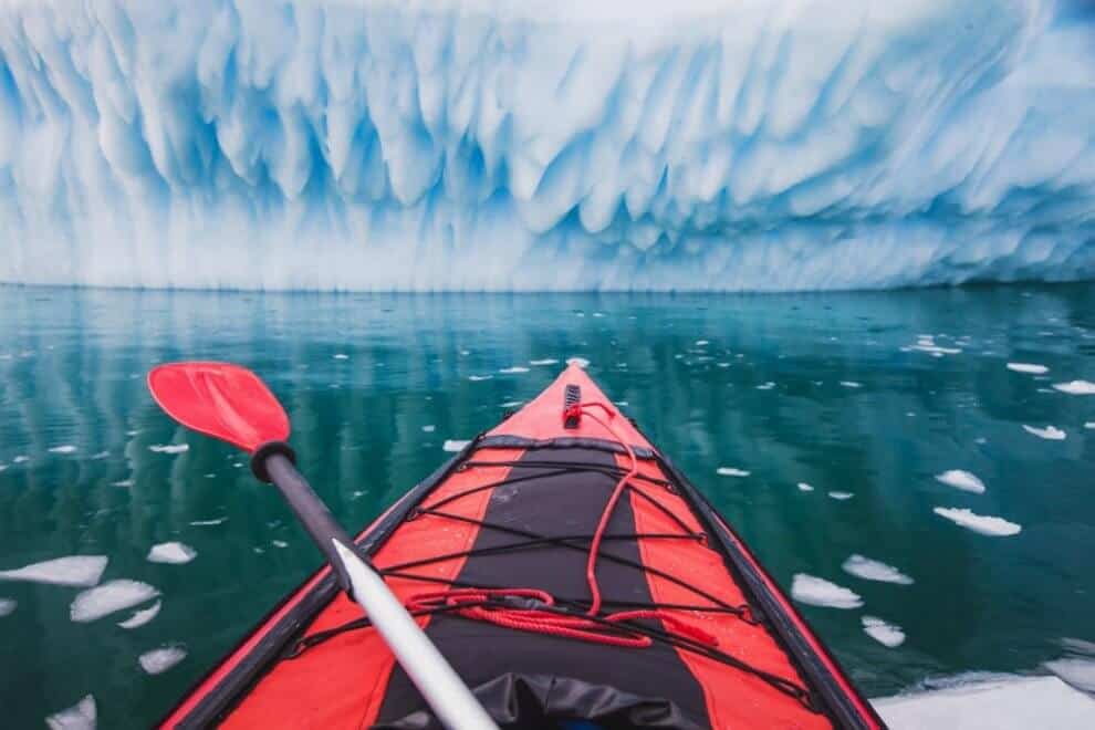 Kayaks in Iceland overlooking a glacier lake
