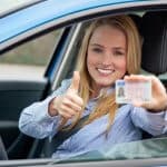 Girl holding her license