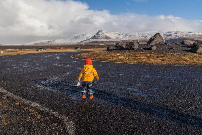 Toddler looking out at Icelandic landscape