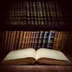 Open book in old-fashioned library chronicling Icleand's history