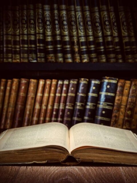 Open book in old-fashioned library chronicling Icleand's history