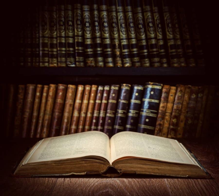 Iceland's Most Famous Villains - The Country's Twisted Past 1 Open book in old-fashioned library chronicling Icleand's history