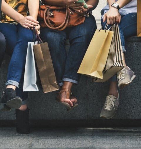 Friends with shopping bags in Reykjavik
