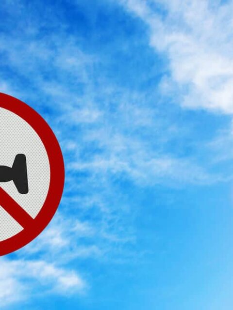 No flying sign showing reasons not to visit Iceland