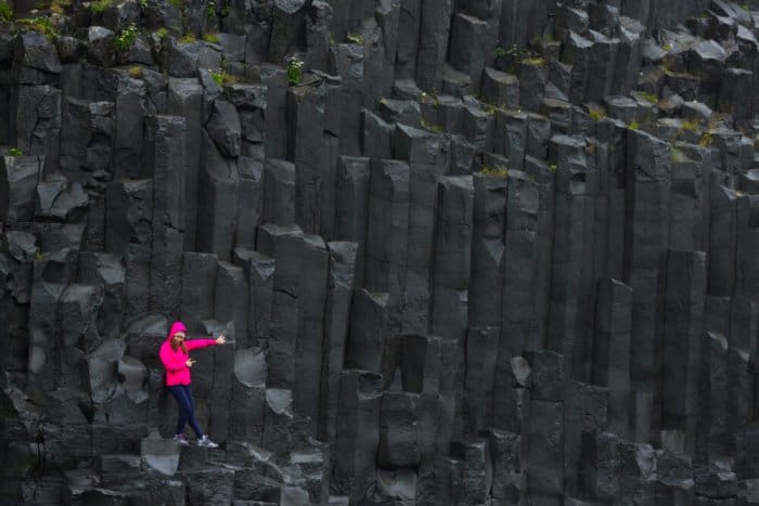 Huge basalt colums in Vik's black sand beaches cliffs