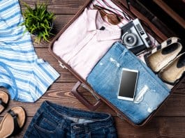 Open suitcase with items on the Iceland summer packing list