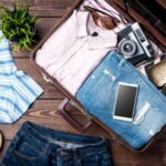 Open suitcase with items on the Iceland summer packing list