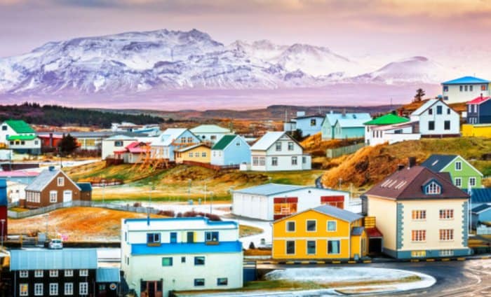 Icelandic town with mountain in the background