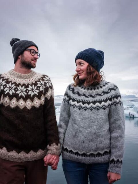A couple of young icelanders wearing the traditional sweater of the icelandic culture