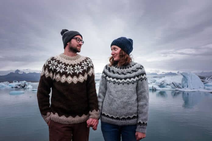 A couple of young icelanders wearing the traditional sweater of the icelandic culture