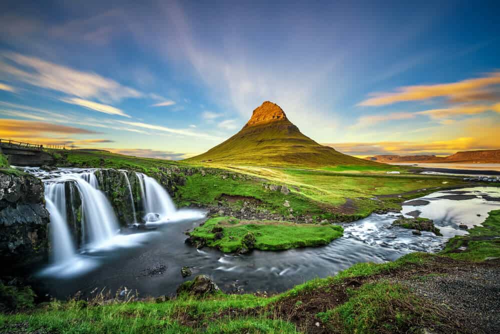 Mount Kirkjufell And Kirkjufellsfoss Waterfall Are Star Attractions In Iceland'S Snaefellsnes Peninsula