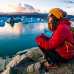 Tourist in cold weather in November at Iceland’s glacier lagoon