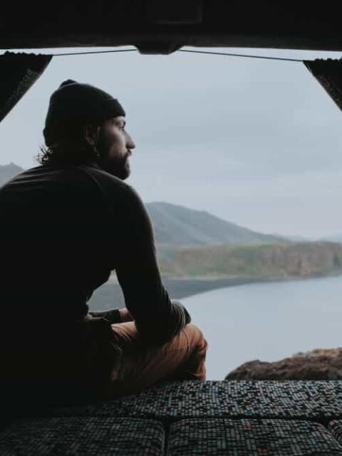Man looking out from his Iceland campervan rental