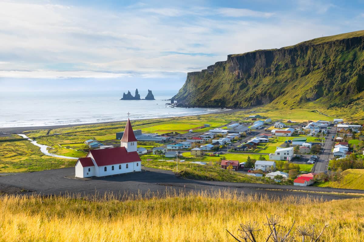 View of coast with Vik church in South Iceland