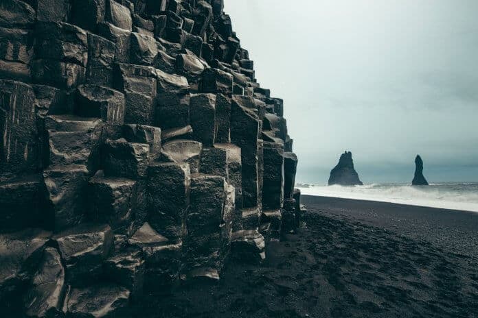 Reynisfjara black sand beaches and basalt columns are Vik's signature natural attraction
