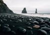 View of pebbles on Iceland's black sand beach Reynisfjara