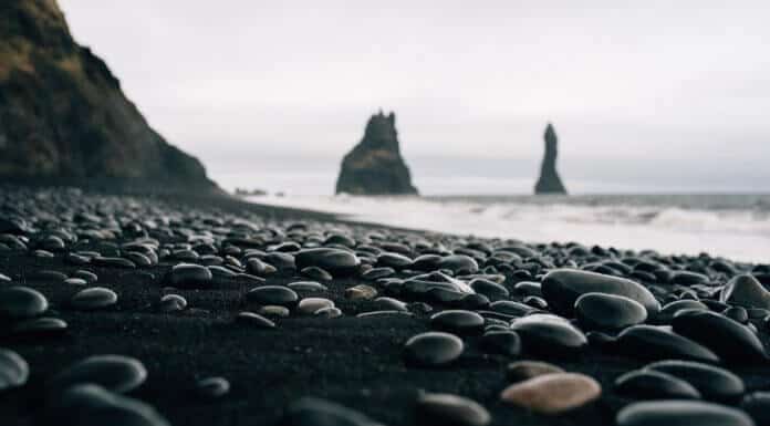View of pebbles on Iceland's black sand beach Reynisfjara