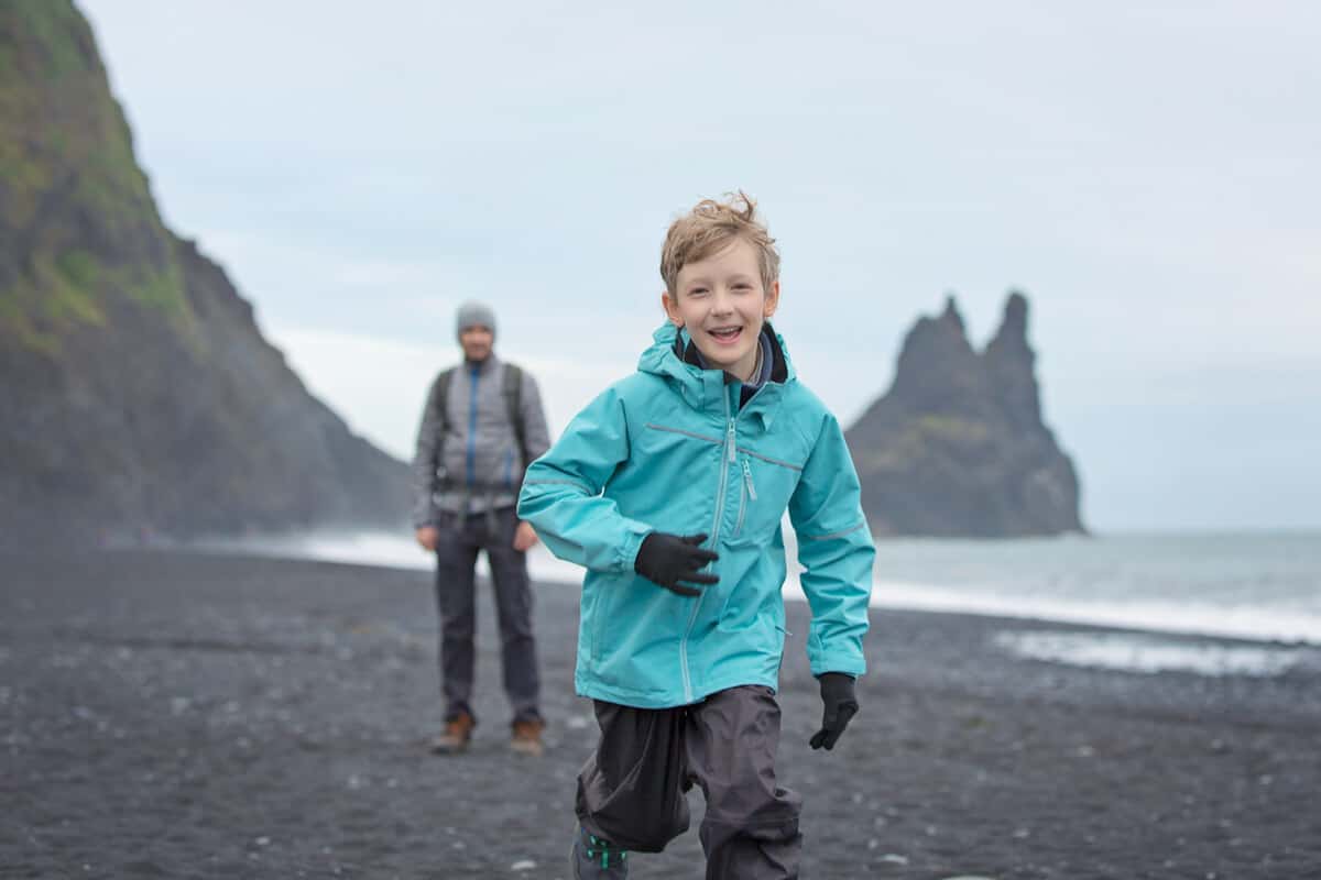 Your Iceland Family Vacation: 5 Things to Do 1 Iceland family vacation with little boy enjoying black sand beaches of Vik