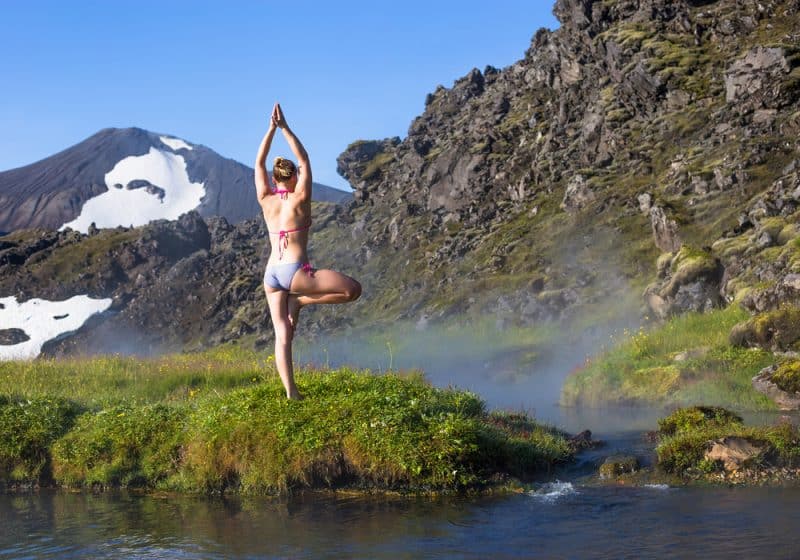 Tourist woman doing Yoga in Iceland